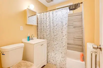 a bathroom with a toilet and a sink and a shower at Convenient Hartford Condo Less Than 2 Mi to Dtwn! in Hartford