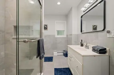 a bathroom with a shower and a sink at 3BR Apt Near Train Balcony Yonkers in Yonkers