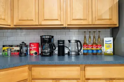 a kitchen counter with a coffee maker on it at Spacious 3BR Apt Near MetroNorth in Yonkers