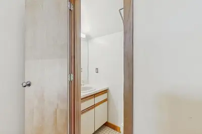 a bathroom with a sink and a mirror at Haystack 32 in Wilmington