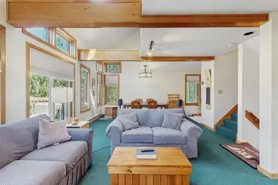 a living room with two couches and a table at Haystack 32 in Wilmington