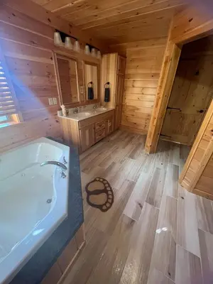 a large bathroom with a tub and a sink at Luxury Cabin with Outdoor HotTub-NEW Construction in Lake Ariel