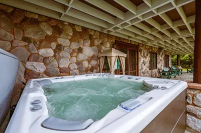 a large jacuzzi tub in a stone building at Welcome to the Lodge! Little Falls NY in Little Falls