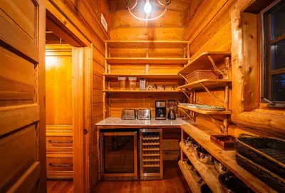 a kitchen in a wooden cabin with a counter top at Welcome to the Lodge! Little Falls NY in Little Falls