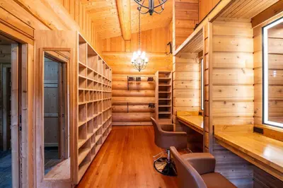 a library with wooden walls and a chair in a room at Welcome to the Lodge! Little Falls NY in Little Falls