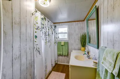 a bathroom with a sink and a shower at 25 Mi to Elk Mtn Skiing! Susquehanna River Cabin