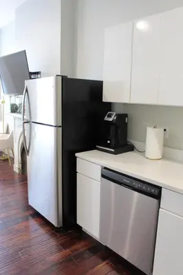 a kitchen with a white refrigerator and a dishwasher at RARE 1BR Apt with Character GREAT Location! in Albany