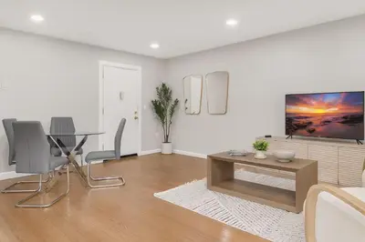 a white living room with a table and chairs at Westville Nest parking NearYale Newly Renovated in New Haven