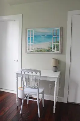 a white desk with a chair and a window at CHIC, Renovated Brownstone in PRIME DT Albany in Albany