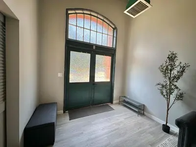 a room with a green door and a window at Private Entrance Cozy Apt Bright Modern in Albany