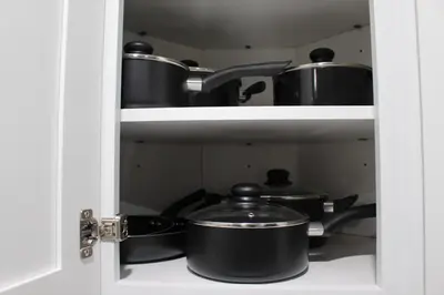 a pantry with pots and pans on a shelf at 2 BEDROOM 1 BATH TRENDY Apt Downtown Albany in Albany