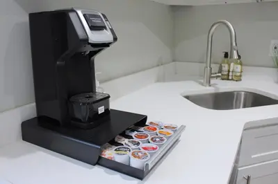 a coffee machine sitting on a counter next to a sink at 2 BEDROOM 1 BATH TRENDY Apt Downtown Albany in Albany