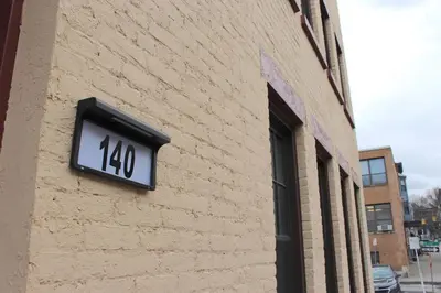 a clock on the side of a brick building at 2 BEDROOM 1 BATH TRENDY Apt Downtown Albany in Albany
