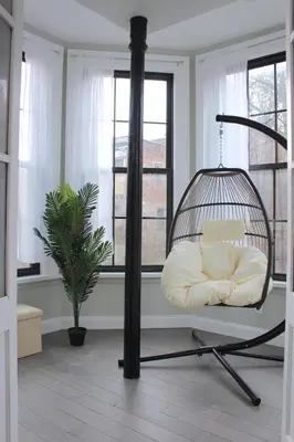 a room with a swing in a room with windows at Beautiful 2 BED 2 BATH Soaker Tub in Albany