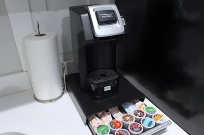 a counter with a box of donuts and a paper towel at UNIQUE Gem in HEART of Albany Spiral Staircase in Albany