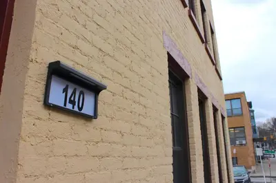 a clock on the side of a brick building at WOW Bright Apt PRIME downtown Walk Everywhere in Albany