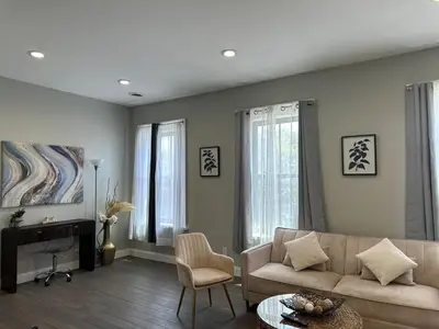 a living room with a couch and a table at Bright & Airy 1 BDRM Private Apt in Albany