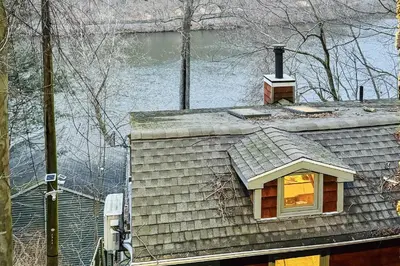 a house with a window on top of it at Lake Zoar Cabin in Newtown