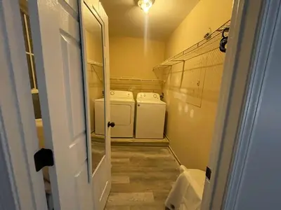 a small laundry room with two washer and dryer at Private Apartment in Southbury 104 in Southbury