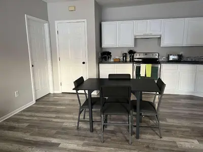 a kitchen with a dining room table and chairs at Private Apartment in Southbury 104 in Southbury