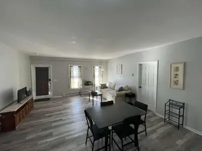 a living room with a couch and a table at Private Apartment in Southbury 104 in Southbury
