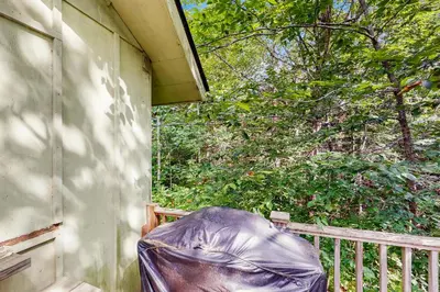 a porch with a trash bag on the side of a house at Ahmeek Retreat in Dover