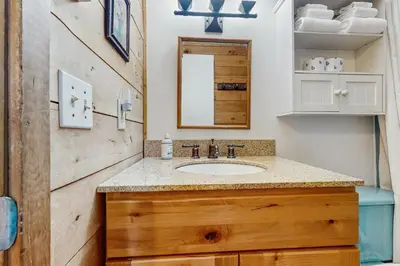 a bathroom with a sink and a mirror at Ahmeek Retreat in Dover