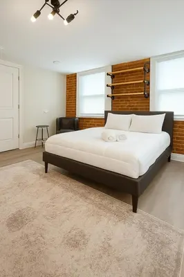 a bedroom with a large bed in a room at Perfect Downtown Stay Yale Walk Sallys Apizza in New Haven
