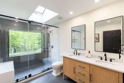 a bathroom with a shower and a sink and a toilet at Modern Catskills Retreat with Creek & Fire Pit in Cairo