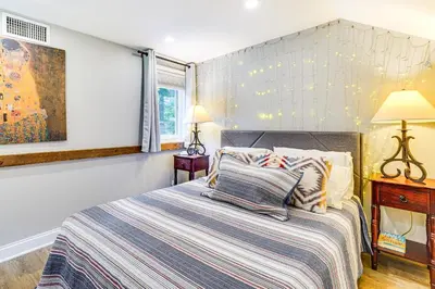 a bedroom with a bed with two pillows on it at Pet-Friendly Cottage, 2 Mi to Saugatuck Falls in Redding