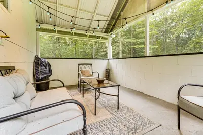 a room with a couch and a table at Pet-Friendly Cottage, 2 Mi to Saugatuck Falls in Redding