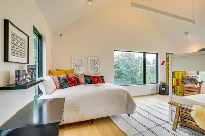 a bedroom with a large bed and a large window at On-Site Sledding! Hudson Valley Winter Escape in Pine Plains