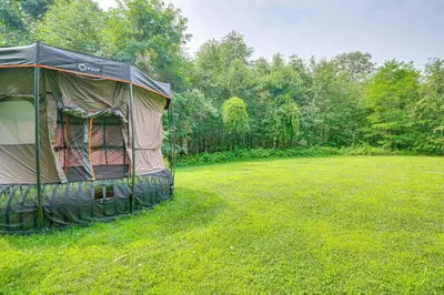 a tent in the middle of a grass field at On-Site Sledding! Hudson Valley Winter Escape in Pine Plains