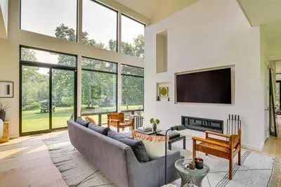 a living room with a couch and a tv at On-Site Sledding! Hudson Valley Winter Escape in Pine Plains