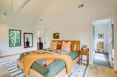 a bedroom with a bed with a blanket on it at On-Site Sledding! Hudson Valley Winter Escape in Pine Plains