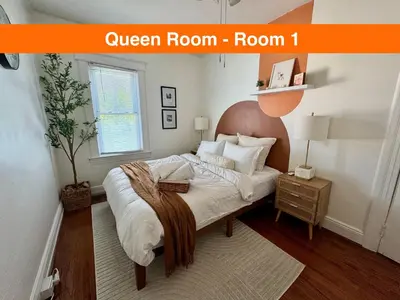 a bedroom with a bed with a brown headboard at 20 min NYC-Modern Private Room-Queen Bed-Parking Available But Confirm with Hosts in Jersey City