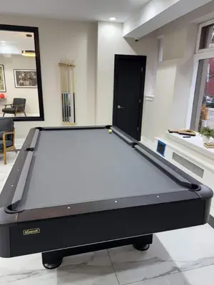 a pool table in the middle of a room at Albany Studio with Kitchen, WiFi, Gym and Game Room Near Capitol in Albany