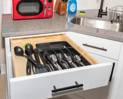 a kitchen counter with a drawer filled with utensils at Central Albany Apartment Private Unit Near Capitol and Empire Plaza in Albany