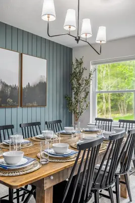 a dining room with a wooden table and chairs at Best Deal in the Poconos! in Tobyhanna