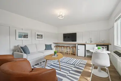 a living room with a couch and a table at Lakelyn Lodge in Lakeville