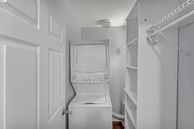 a white laundry room with a washer and dryer at The Main Lineup 3 - All Star Baseball Rentals in Oneonta