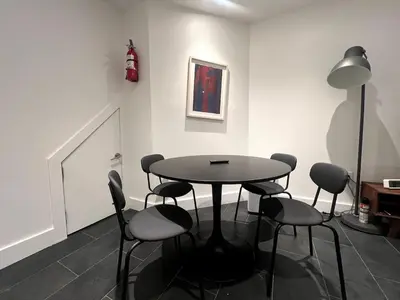 a dining room with a table and chairs at Massive NYC Brownstone wPatio in New York