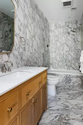 a bathroom with a sink and a toilet and a tub at Massive NYC Brownstone wPatio in New York