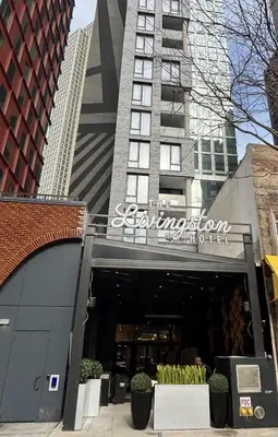 a store front of a building with a sign on it at The Livingston, part of JdV by Hyatt in Brooklyn