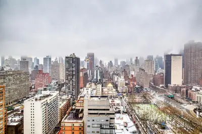 a cityscape of a city with tall buildings at Blueground Murray Hill balcony nr East River NYC-720 in New York