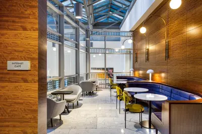 a restaurant with tables and chairs and a pool at Blueground Murray Hill balcony nr East River NYC-720 in New York