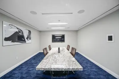 a conference room with a table and chairs at Blueground Murray Hill balcony nr East River NYC-720 in New York