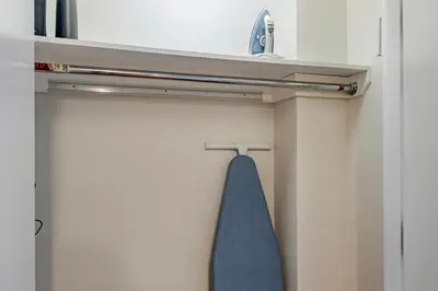 a towel hanging on a towel rack in a bathroom at Blueground Lenox Hill view nr Central Park NYC-2019 in New York