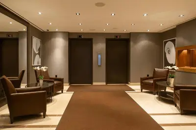 a waiting room with chairs and tables in a building at Blueground Lenox Hill view nr Central Park NYC-2019 in New York