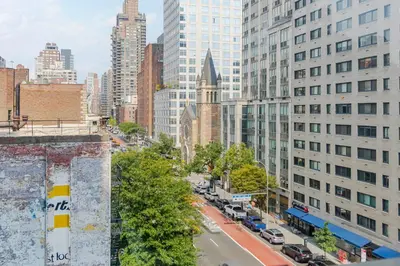 an aerial view of a city street with buildings at Blueground Lenox Hill view nr Central Park NYC-2019 in New York